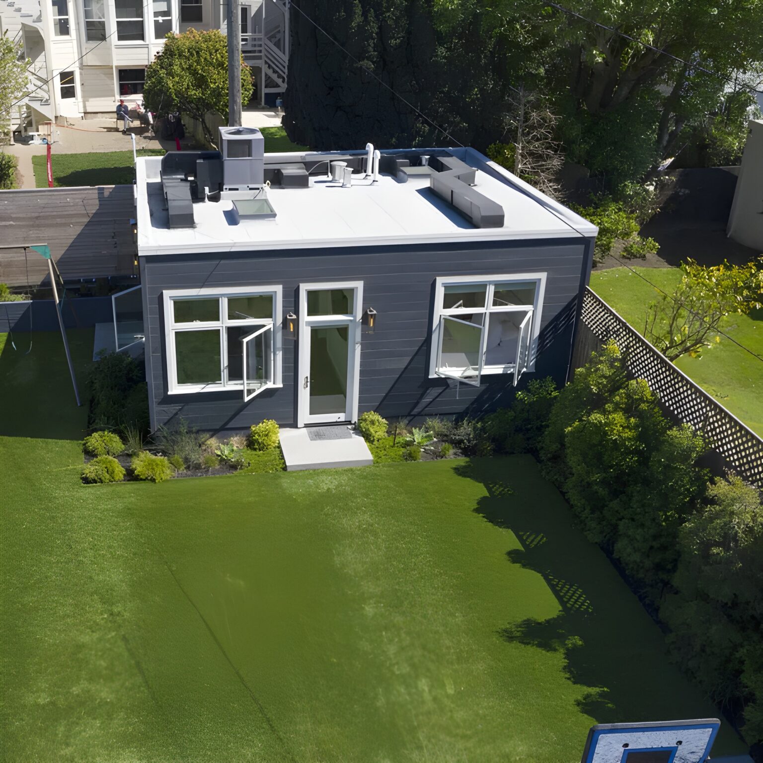 ADU Builder in Alameda 32 a house with a basketball hoop in the back yard
