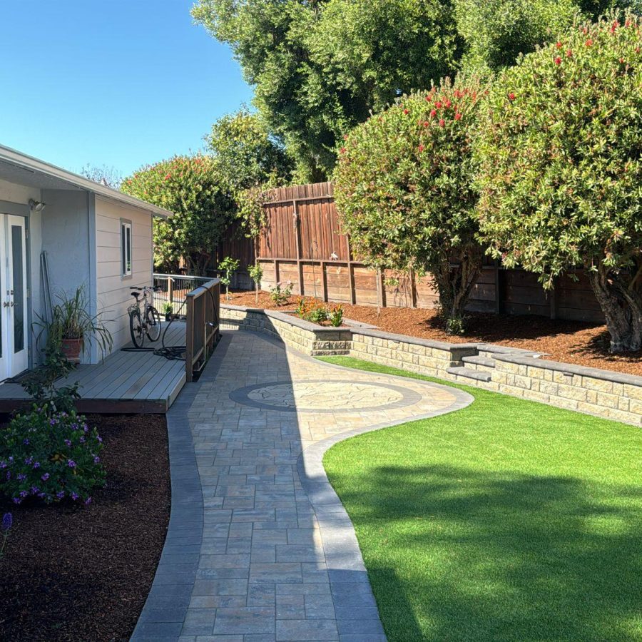 474542185_122167024484278422_8189321133244880559_n a walkway with a brick walkway and a fence and trees. Expertly installed retaining walls in Berkeley