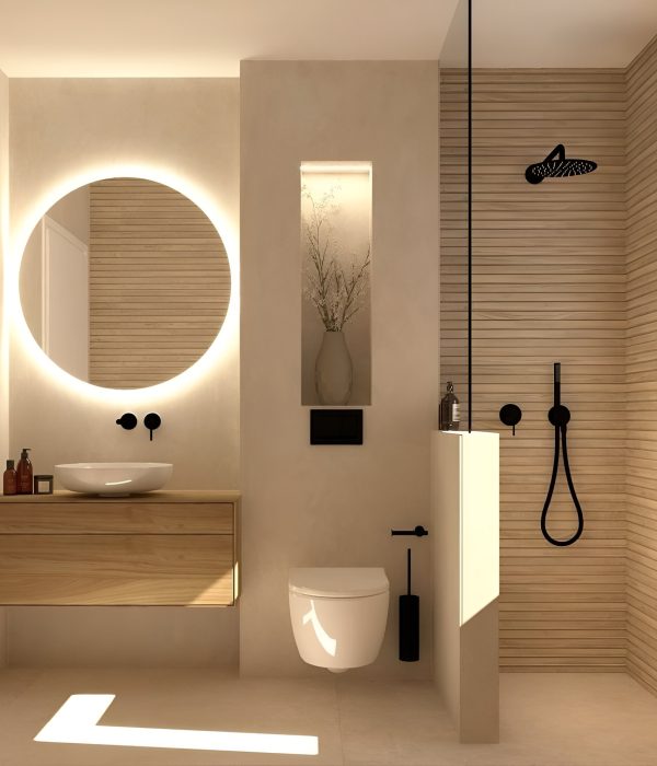 a bathroom with a round mirror and a toilet