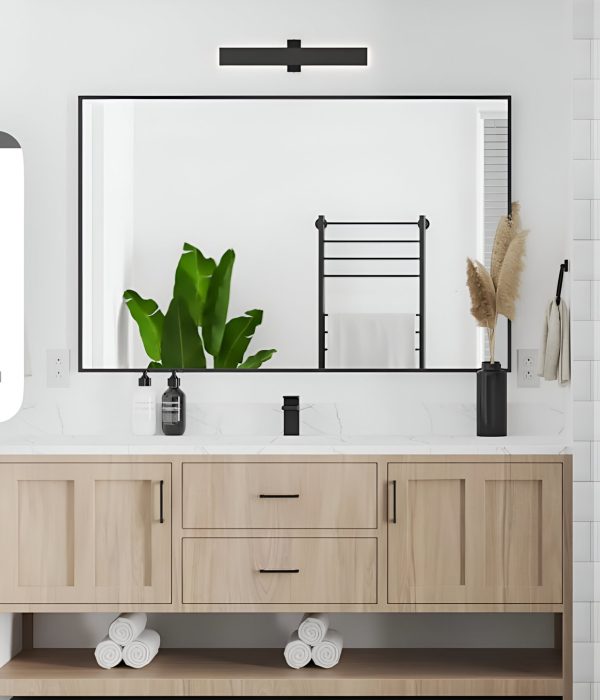 476751029_17920639755046845_5791508614470929112_n (1) Bathroom with light wood vanity and large mirror surrounded by decorative plants