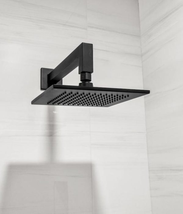Bathroom Remodeling in Sunnyvale3 bathroom remodeling in Sunnyvale. Black showerhead against a white tile bathroom wall
