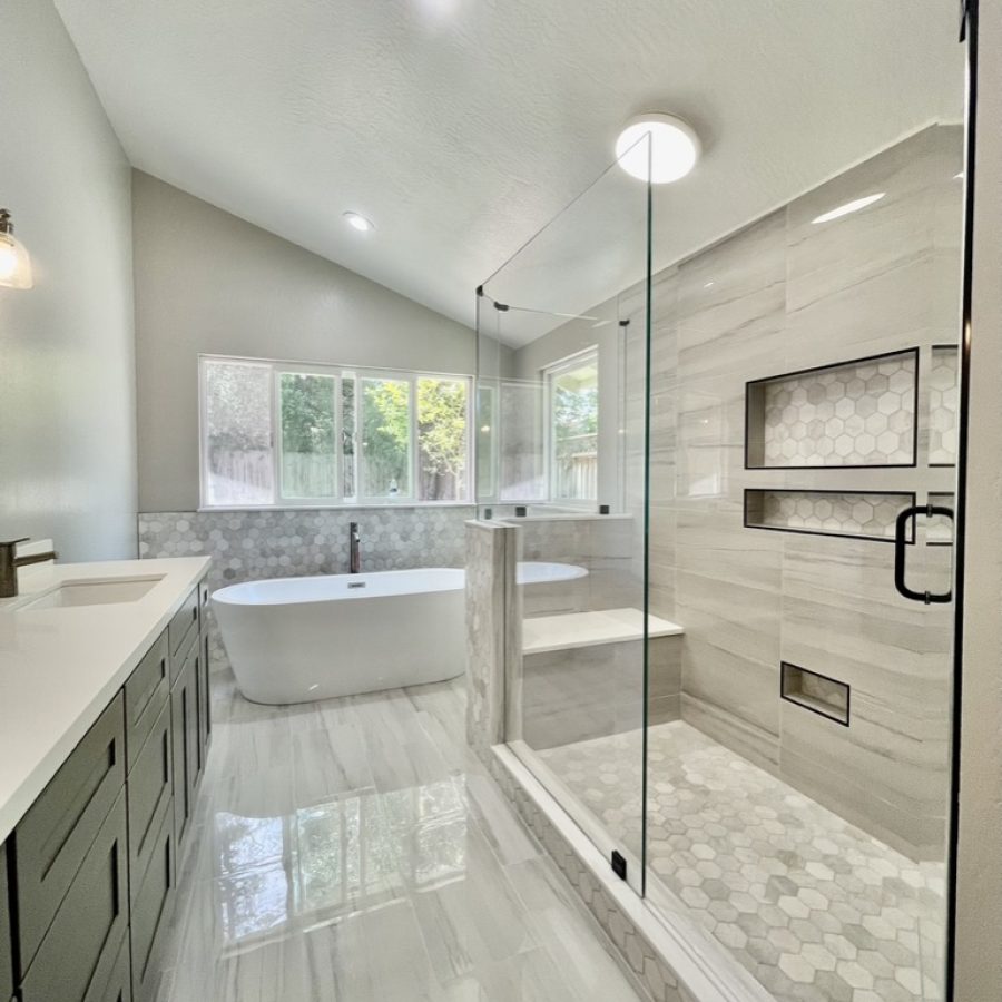 C50D8BB5-77CD-4883-897E-359B775CE0A1_1_105_c Beautiful monochromatic bathroom with a doublet vanity, large walk-in shower, and a bath