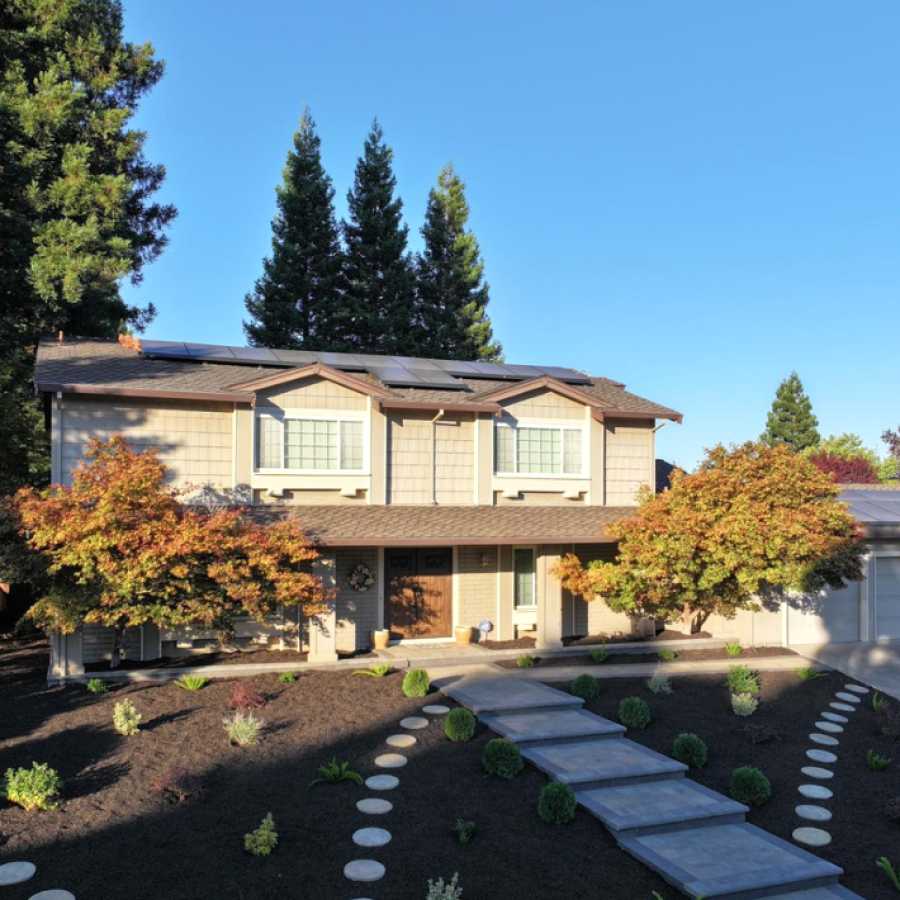 landscape_design Professional landscape design. Beautiful stonework creating a path to a yellow home. The best landscape design in San Leandro