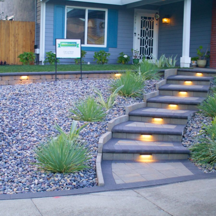 Geico builders professional landscape design. Gorgeous paver walkway leading to a house surrounded by green bushes. General contractor in Orinda, California