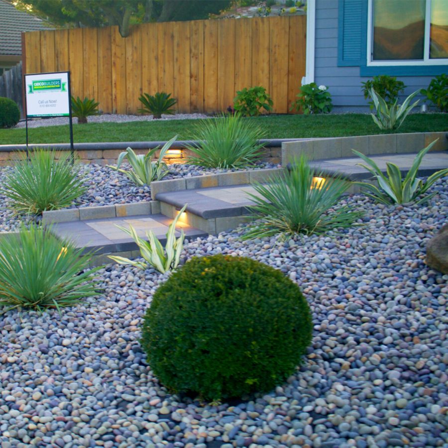 Copy of Untitled_2.9.11 Expert landscape design in Dublin. Beautiful paver walkway surrounded by a rock garden with bushes dispersed throughout. The best landscape design in Oakland