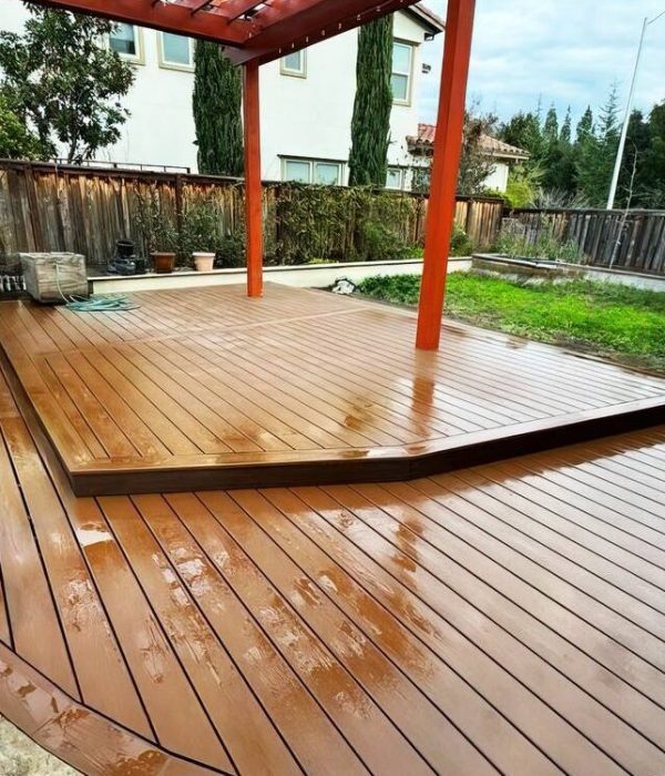 Deck – Erick4 Professionally installed red toned wooden deck with a red pergola