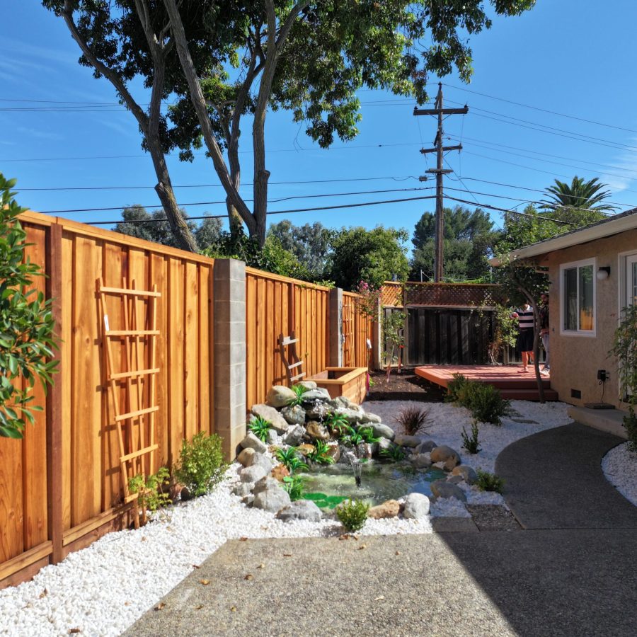 Expertly installed fencing, paver patio, and outdoor pond by Geico Builders, the #1 general contractor in Moraga