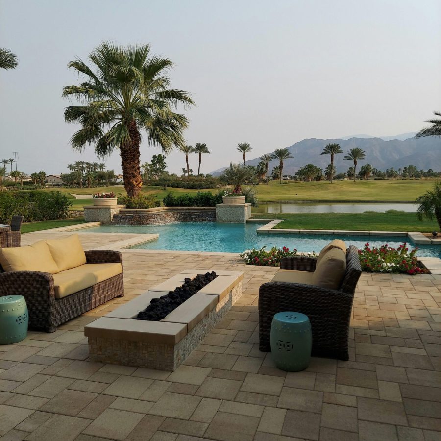 pavers Beautiful paver installation with modern furniture and palm trees in the back
