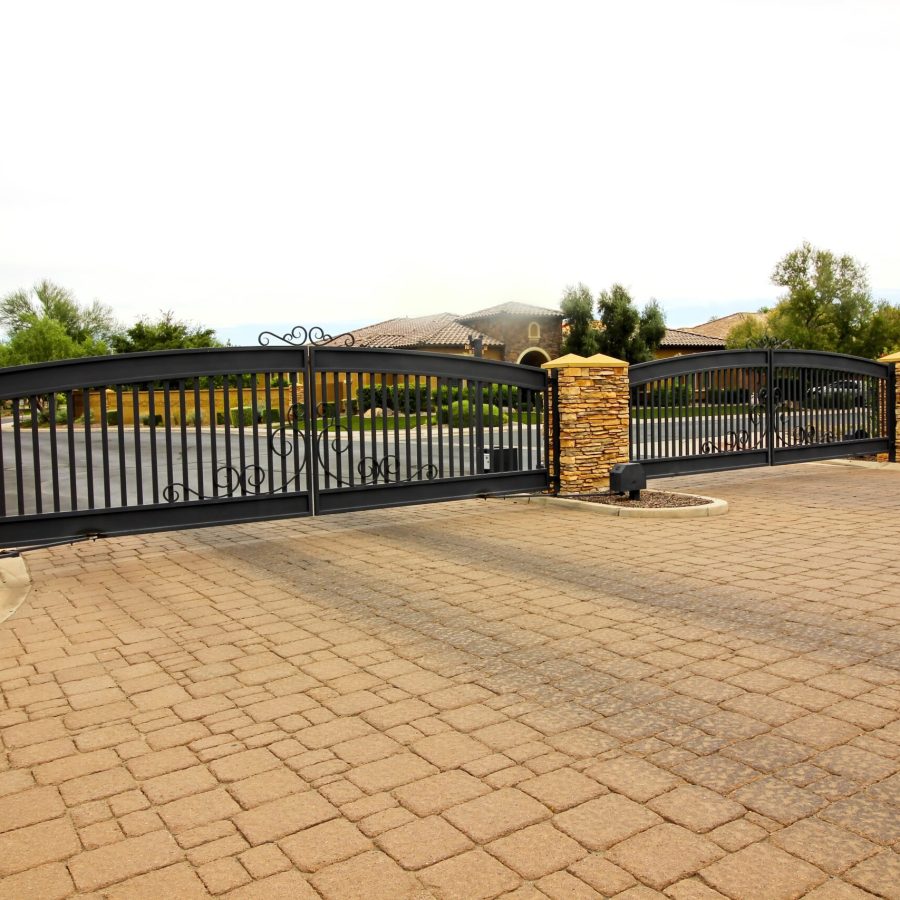 Two Iron Entry And Exit Electric Gates With Pavers Driveway Two Iron Entry And Exit Electric Gates With Pavers Driveway
